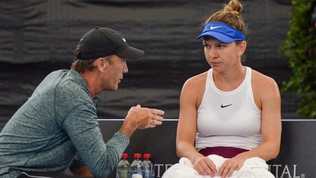 Simona Halep of Romania talks to her coach Darren Cahill during her quarter-final match against Aryna Sabalenka of Belarus at the Adelaide International. Picture: AFP