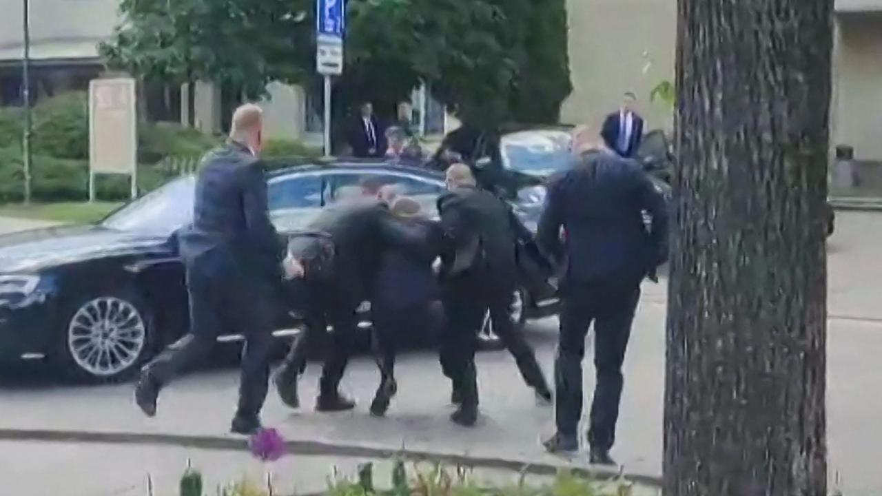 Slovakia’s Prime Minister Robert Fico being bundled into a car after being shot. Picture: RTVS / AFP)