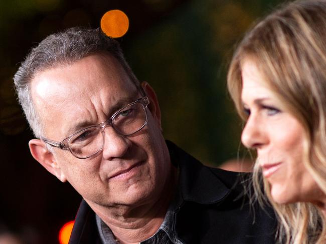 (FILES) In this file photo Actors Tom Hanks (L) and his wief actress/singer Rita Wilson attend "JONI 75: A Birthday Celebration" Live at the Dorothy Chandler Pavilion in Los Angeles on November 7, 2018. - Tom Hanks and his wife Rita Wilson have both tested positive for coronavirus, the US actor said Wednesday. Hanks, 63, said he and Wilson came down with a fever while in Australia, and will now be isolated and monitored. (Photo by VALERIE MACON / AFP)