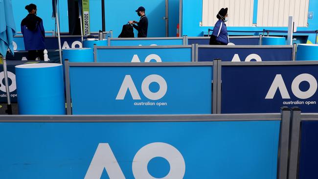 Security staff wearing face masks stand guard at one of the entry point of the Australian Open venue in Melbourne today. Picture: AFP