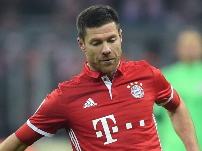 Bayern Munich's Spanish midfielder Xabi Alonso plays during the German first division Bundesliga football match FC Bayern Munich vs RB Leipzig in Munich, Germany, on December 21, 2016. / AFP PHOTO / Christof STACHE / RESTRICTIONS: DURING MATCH TIME: DFL RULES TO LIMIT THE ONLINE USAGE TO 15 PICTURES PER MATCH AND FORBID IMAGE SEQUENCES TO SIMULATE VIDEO. == RESTRICTED TO EDITORIAL USE == FOR FURTHER QUERIES PLEASE CONTACT DFL DIRECTLY AT + 49 69 650050