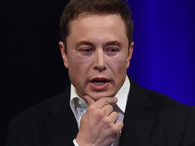 (FILES) In this file photo taken on September 29, 2017 Billionaire entrepreneur and founder of SpaceX Elon Musk speaks at the 68th International Astronautical Congress 2017 in Adelaide.  Bases on the moon and Mars could help preserve human civilization and hasten its regeneration on earth in the event of a third world war, billionaire entrepreneur Elon Musk, said on March 11, 2018. Musk, the founder of rocket and spacecraft company SpaceX, said the company's interplanetary ship could begin test flights as soon as next year. There is "some probability" that there will be another Dark Ages, "particularly if there is a third world war," Musk said at the SXSW conference.  / AFP PHOTO / PETER PARKS