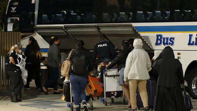 People at Brisbane airport heading to hotel quarantine during the pandemic. Picture:Josh Woning