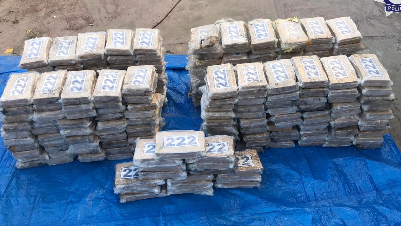 The AFP has charged two men with importing a commercial quantity of cocaine as part of an investigation into 247kg of cocaine seized from a yacht moored in Townsville.