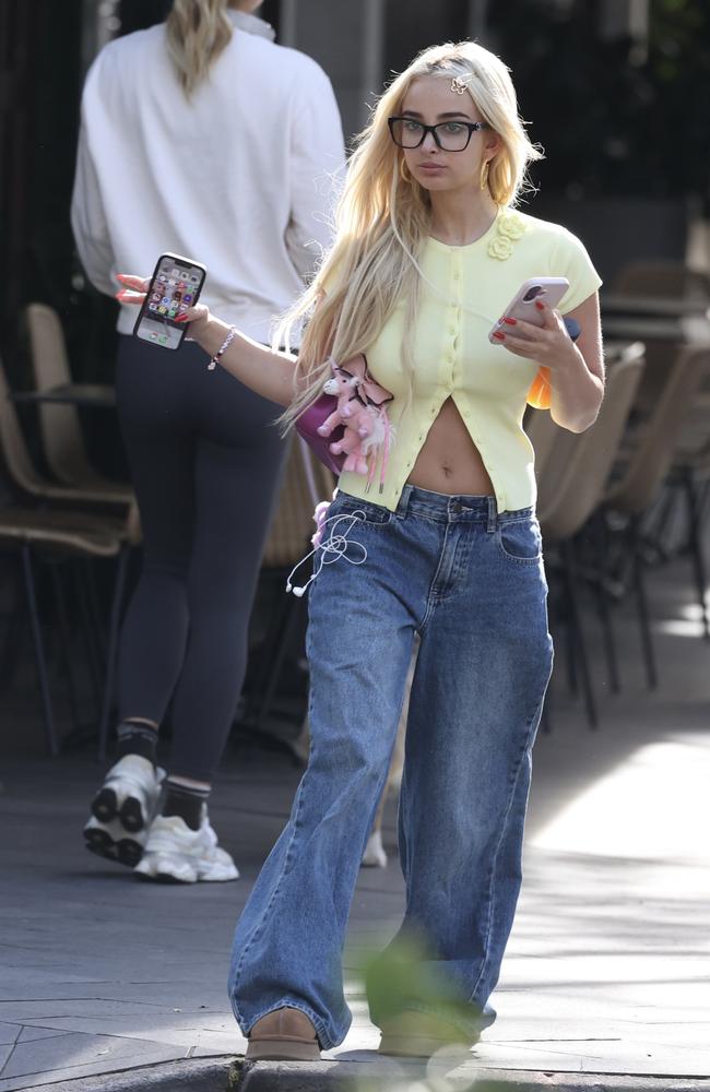 The ‘it girl’ paired a cropped yellow top with slouchy blue jeans. Picture: Media Mode