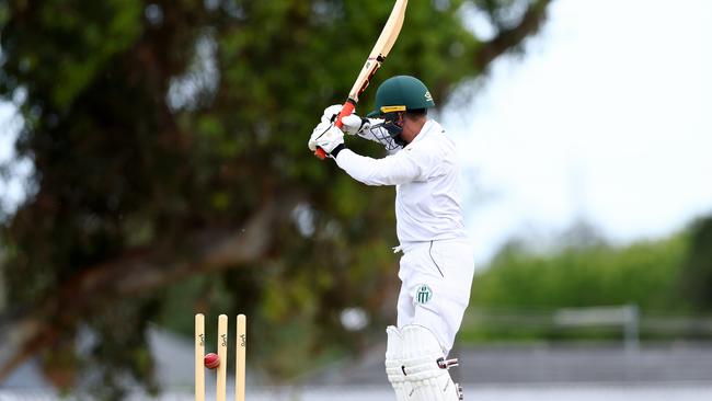 Chameera Perera of Craigieburn is bowled by Ben Walkden of Airport West St Christophers. (Photo by Josh Chadwick)