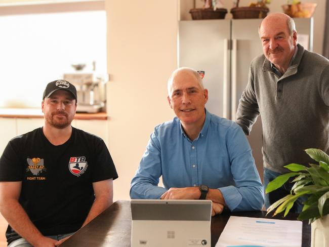 Energy and Renewables Minister Nick Duigan is joined by Liberal member Mark Shelton and homeowner Nic Collar, as the Renewable Energy Dividend hits the energy accounts of every Tasmanian household and small business. Picture: Stephanie Dalton