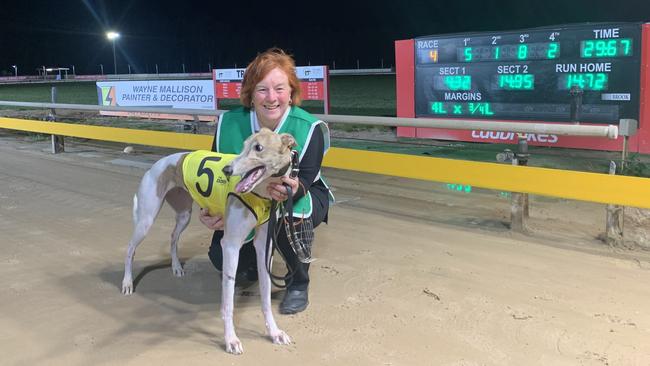 Ann Barnes, a Dubbo trainer and daughter of Peg Miller who has a support event named in her honour, with champion greyhound Nangar Silk. Picture: Supplied