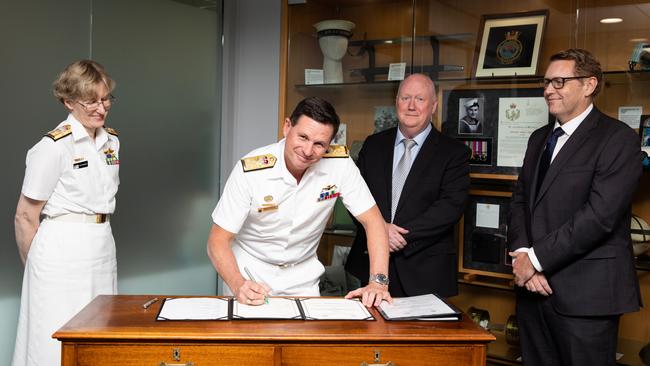 Chief of Navy Vice Admiral Mark Hammond signs the MOU alongside Head of Navy Engineering Rear Admiral Kath Richards, AMSA CEO Mick Kinley and AMSA executive director operations Michael Drake in Russell Offices, Canberra.