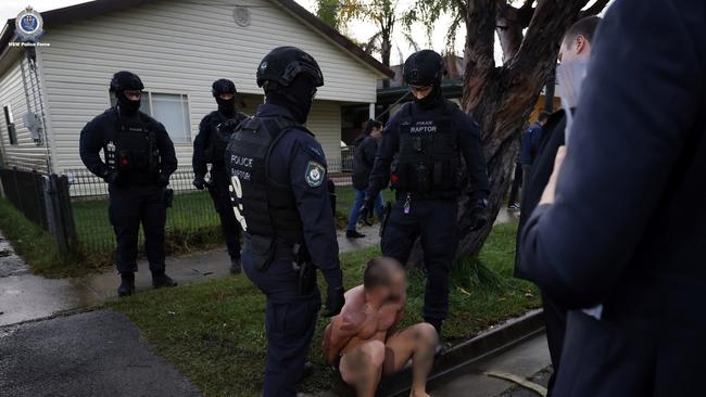 Officers executed a co-ordinated dawn take-down, arresting 18 people. Picture: NSW Police