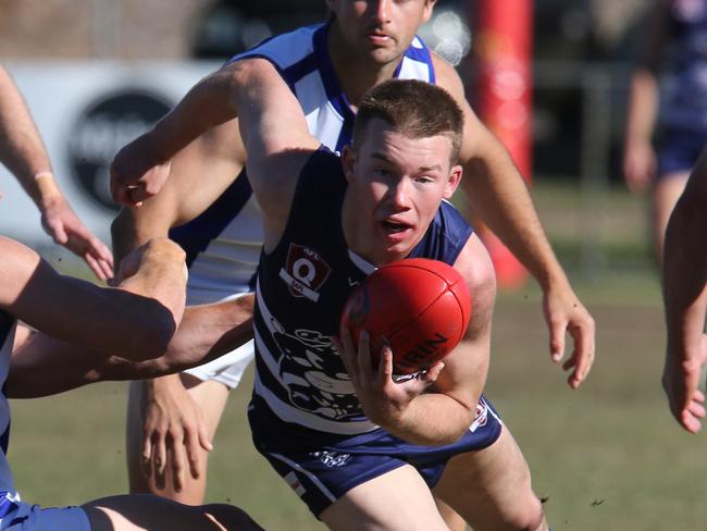 Round 13 QAFL Aussie rules game between Broadbeach and Mt Gravatt. Cats Kai Sheers breaks away from Vultures Zac Stone. Picture Glenn Hampson