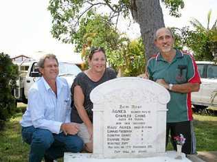 Descendents of the survivors, including (from left) Paul Steindl, Hanni Steindl and Lance Steindl, at the family grave in Sarina Cemetery, will meet this week to pay their respects to their slain ancestors. Picture: Lee Constable