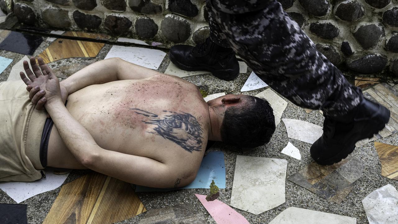 A suspected narco trafficker is detained on February 11. Picture: John Moore/Getty Images