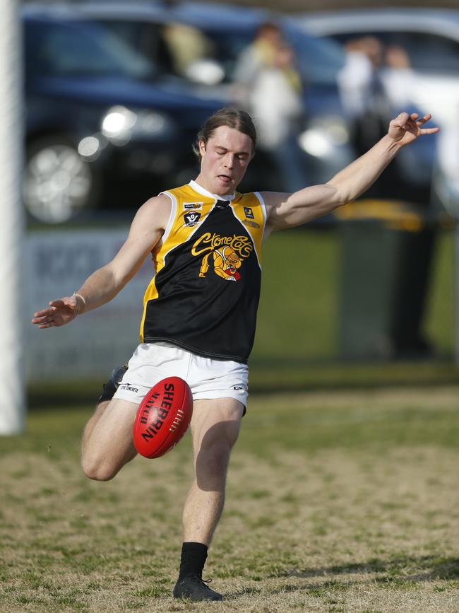 Frankston YCW’s Matt La Fontaine takes a kick.