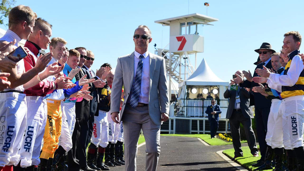 Damian Browne receiving a guard of honour by fellow jockeys. Picture: Trackside Photography