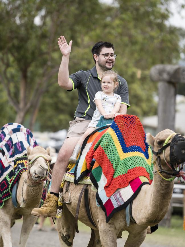 Ivy Rust and dad Michael Rust enjoy a camel ride at the Toowoomba Royal Show, Saturday, April 1, 2023. Picture: Kevin Farmer