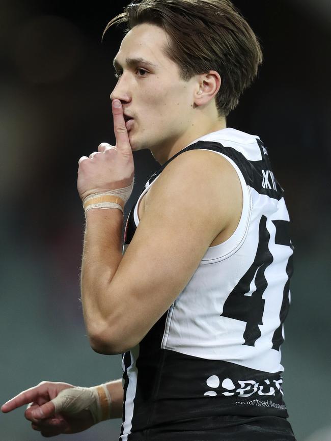 Tobin Cox tries to silence Crows fans during the qualifying final. Picture: SARAH REED