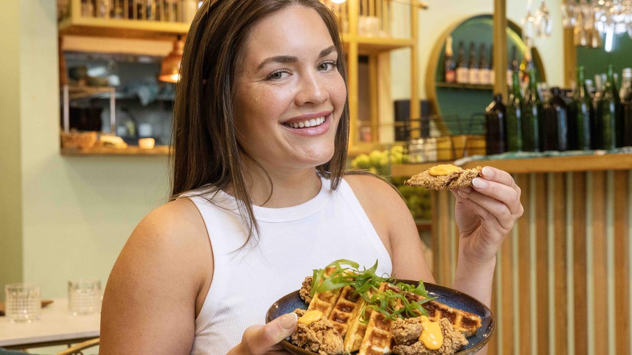 Tayla McKay loves Hello Neighbour’s buttermilk fried chicken and waffles, with maple syrup and sriracha mayo. Picture: Kelly Barnes