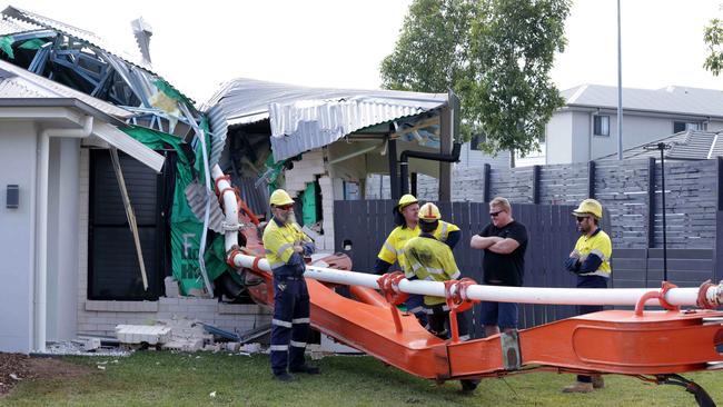 A concrete pumping truck toppled onto a house opposite where it was doing a concrete pour, Deebing Heights, Ipswich, on Friday 23rd June 2023 - Photo Steve Pohlner