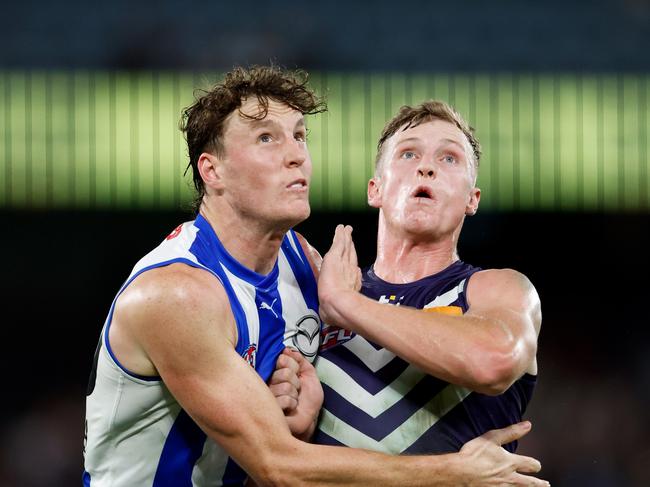 MELBOURNE, AUSTRALIA - MARCH 23: Nick Larkey of the Kangaroos and Josh Treacy of the Dockers compete in a ruck contest during the 2024 AFL Round 2 match between the North Melbourne Kangaroos and the Fremantle Dockers on March 23, 2024 in Melbourne, Australia. (Photo by Dylan Burns/AFL Photos via Getty Images)