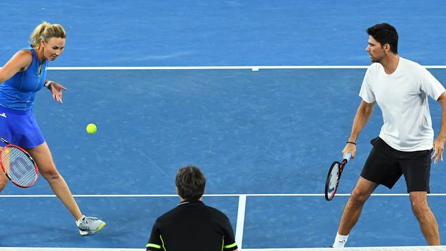 Mark Philippoussis in action with Alicia Molik during their mixed doubles match against Goran Ivanisevic of Croatia and Daniela Hantuchova of Slovakia on Wednesday. Picture: Getty Images.