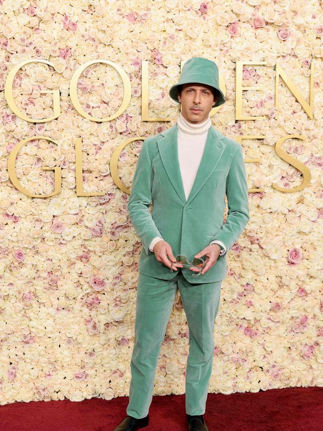 Jeremy Strong wears a matching sage green bucket hat and suit from Loro Piana. Picture: Getty