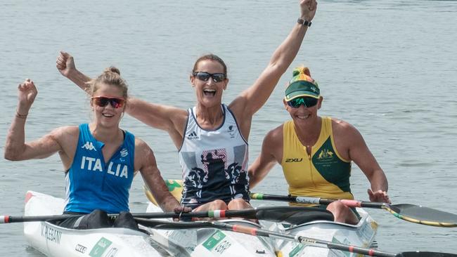 UK's Anne Dickins (C), Australia's Amanda Reynolds and Italy's Veronica Yoko Plebani after the final of the women's canoe sprint.