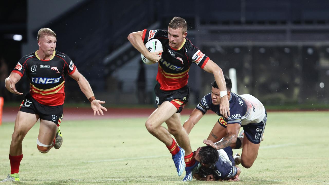 Dolphin's Jordan Lipp disposes of the Cowboys players in the National Rugby League (NRL) pre season NRL match between the North Queensland Cowboys and the Dolphins, held at Barlow Park. Picture: Brendan Radke