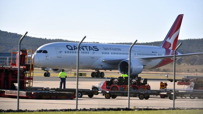 A Qantas repatriation flight in Canberra. Pilots are frustrated by the strict quarantine regulations they must observe despite being fully vaccinated. Picture: AAP