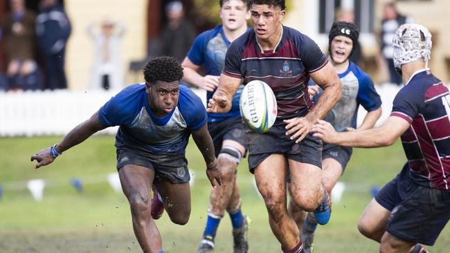 Lastus Auakai unloads the ball last weekend. Picture: Renae Droop