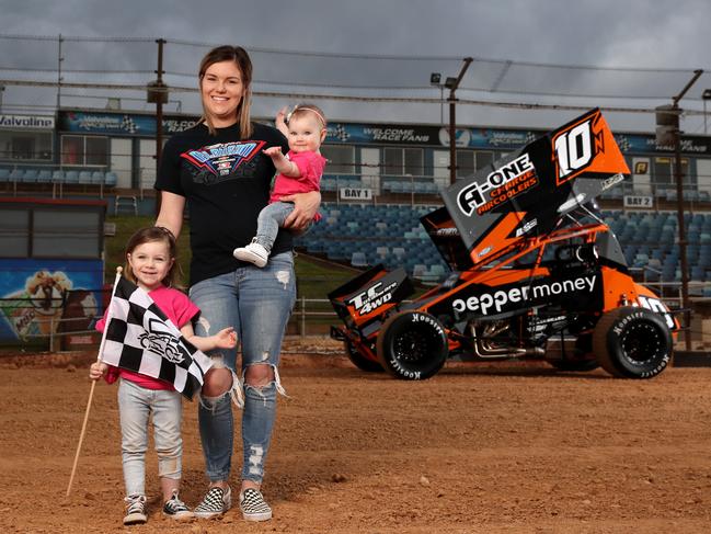 Born to race: Mikaela Blyton and her daughters, Callie, 3, and Addie, eight months, at Valvoline Raceway. Picture: Jonathan Ng