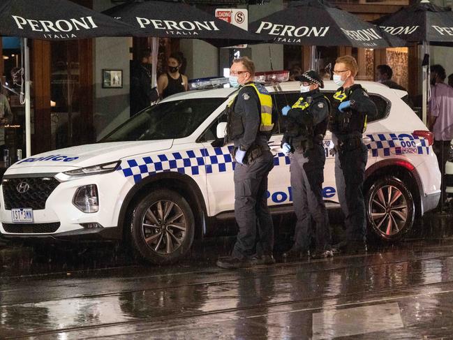 Large group of police patrol Chapel Street. Picture: Tony Gough