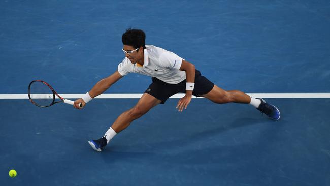 Hyeon Chung goes full stretch to return to Novak Djokovic in his sensational win over the six-time Australian Open champion last night. Picture: AFP