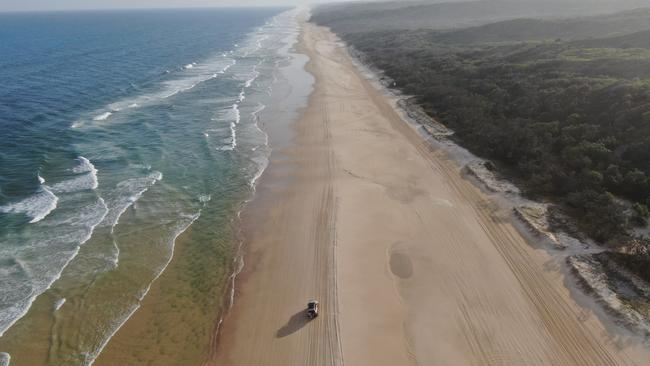 Driving on the beach on K'gari (Fraser Island), Queensland. Picture: TEQ