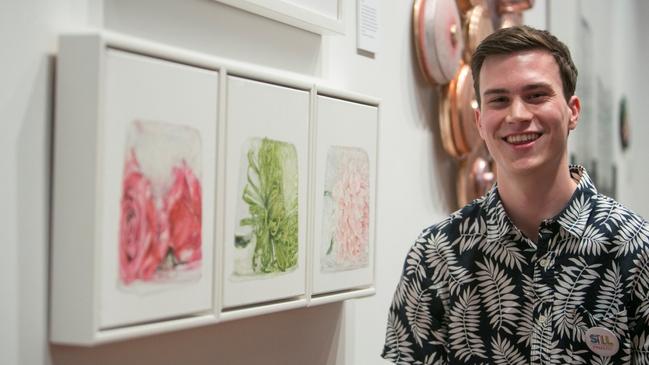 Ben Fayle with his Still National Life Award 2019 entry, Rose Disbud Chrysanthemum and Dahlia.