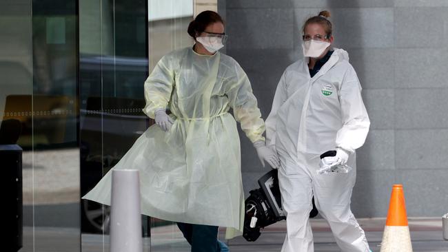 Emergency personnel are seen in full hazmat gear entering Peppers hotel on the Gold Coast. Photo: MEGA TheMegaAgency.com