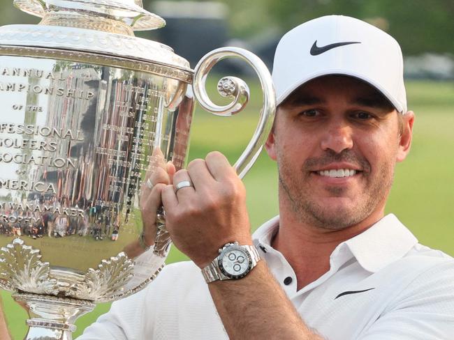 ROCHESTER, NEW YORK - MAY 21: Brooks Koepka of the United States celebrates with the Wanamaker Trophy after winning the 2023 PGA Championship at Oak Hill Country Club on May 21, 2023 in Rochester, New York.   Andy Lyons/Getty Images/AFP (Photo by ANDY LYONS / GETTY IMAGES NORTH AMERICA / Getty Images via AFP)