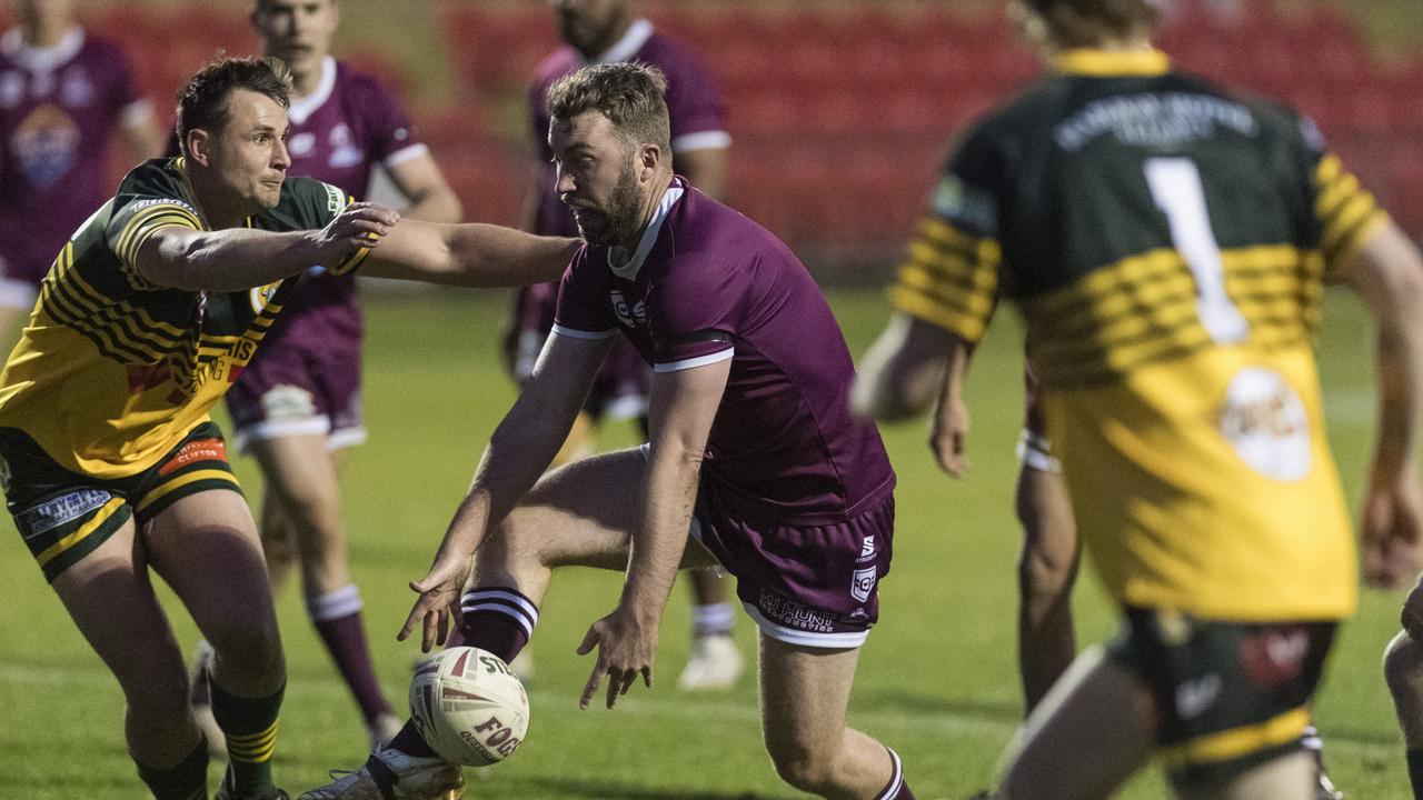 Jed Bryers (centre) of Dalby against Wattle. Picture: Kevin Farmer