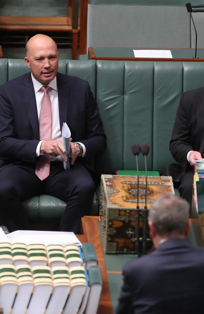 Peter Dutton watches on as Opposition leader Bill Shorten fires up. Picture: Kym Smith