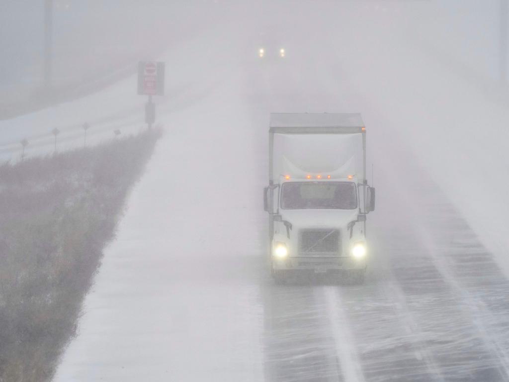 A transport truck drives along Highway 401 in London, Ontario, Canada, during a large winter storm on Friday, December 23, 2022. Picture: by Geoff Robins / AFP.