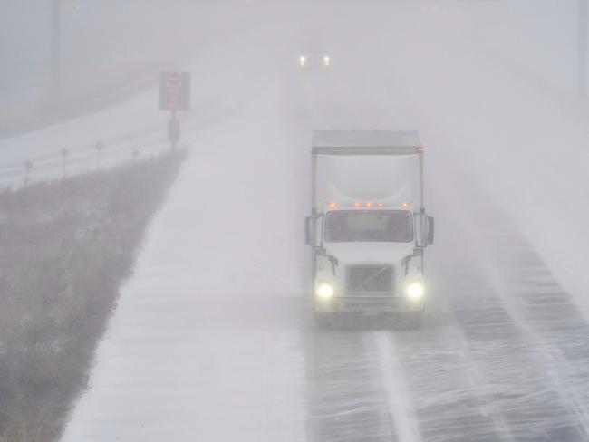 A transport truck drives along Highway 401 in London, Ontario, Canada, during a large winter storm on Friday, December 23, 2022. Picture: by Geoff Robins / AFP.