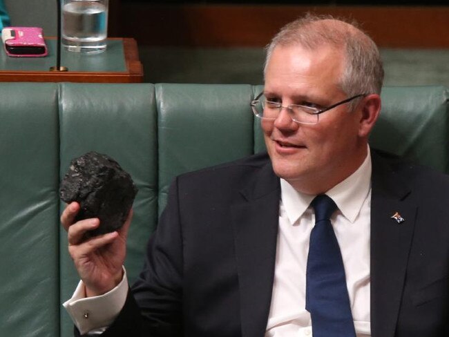 Scott Morrison with a lump of coal in parliament.