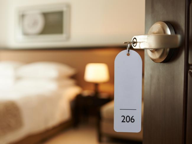 Opened door of hotel room with key in the lock. Picture: iStockFAQ What to do when ... Sarah Nicholson, Escape