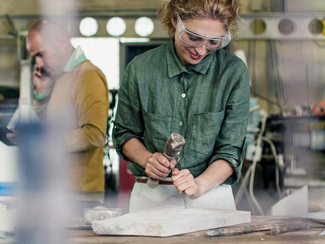 TRADESWOMAN/ TRADE WOMAN/ TRADESMAN/ TRADIE/BUILDING INDUSTRY: Stonecutter at his workshop, Ljubljana, Slovenia