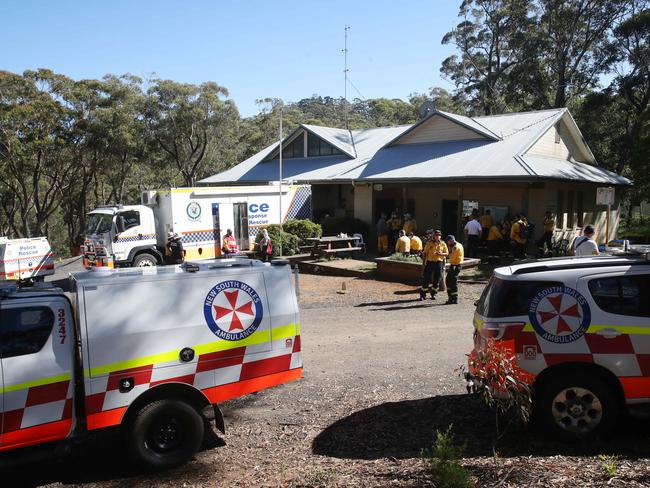 Police and RFS search bushland around the property. Picture: David Swift