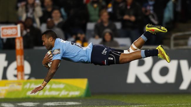 Winger Alofa Alofa dives over to score one of his two tries for the Waratahs.