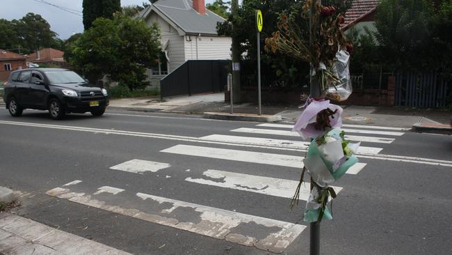 Flowers left at the crossing on the intersection of Frederick st and John St after an 87-year-old man was hit and killed in April. Picture: Alexi Demetriadi