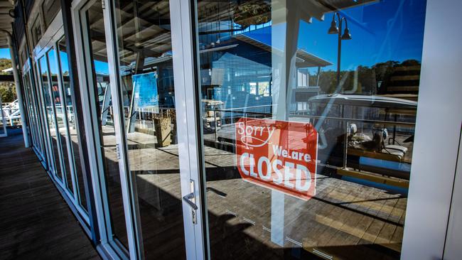 A sign at the marina of Couran Cove, noting its closure. Picture: Nigel Hallett