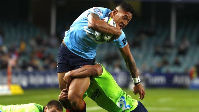 Israel Folau tries to bust through the Highlanders defence.