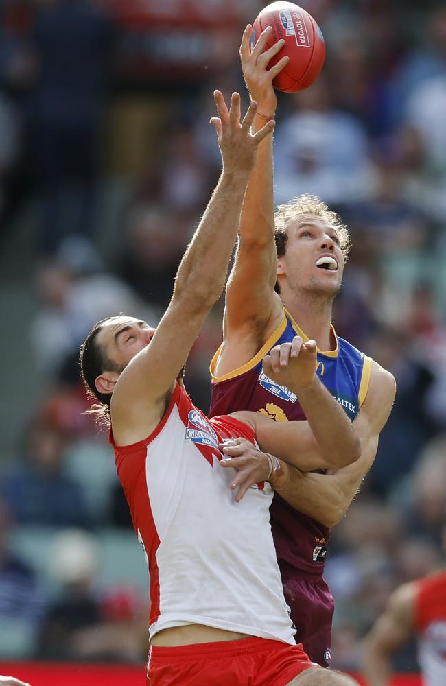 Darcy Fort of the Lions wins the ruck tap over Brodie Grundy. Picture: Michael Klein